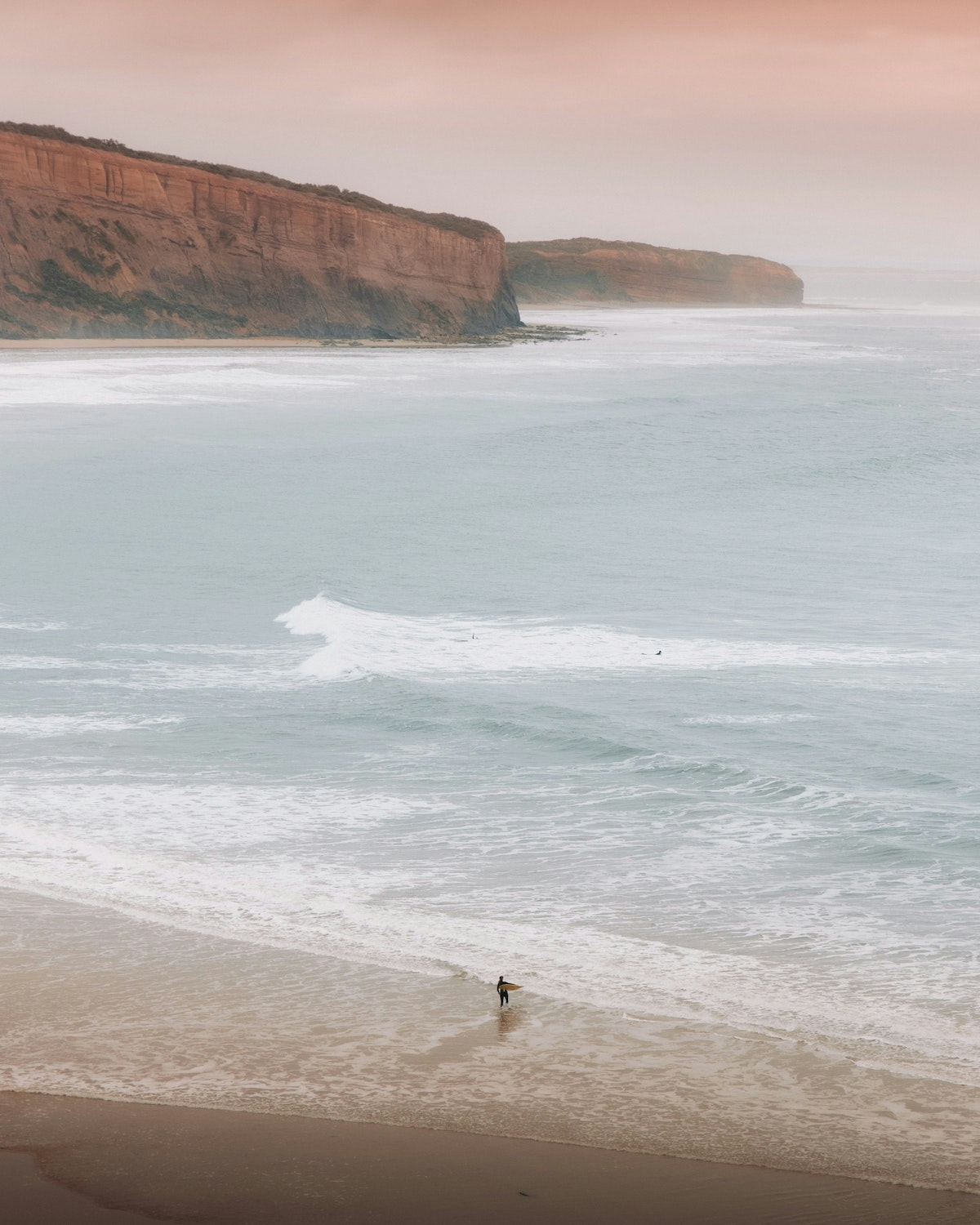 Surfer on a clean beach